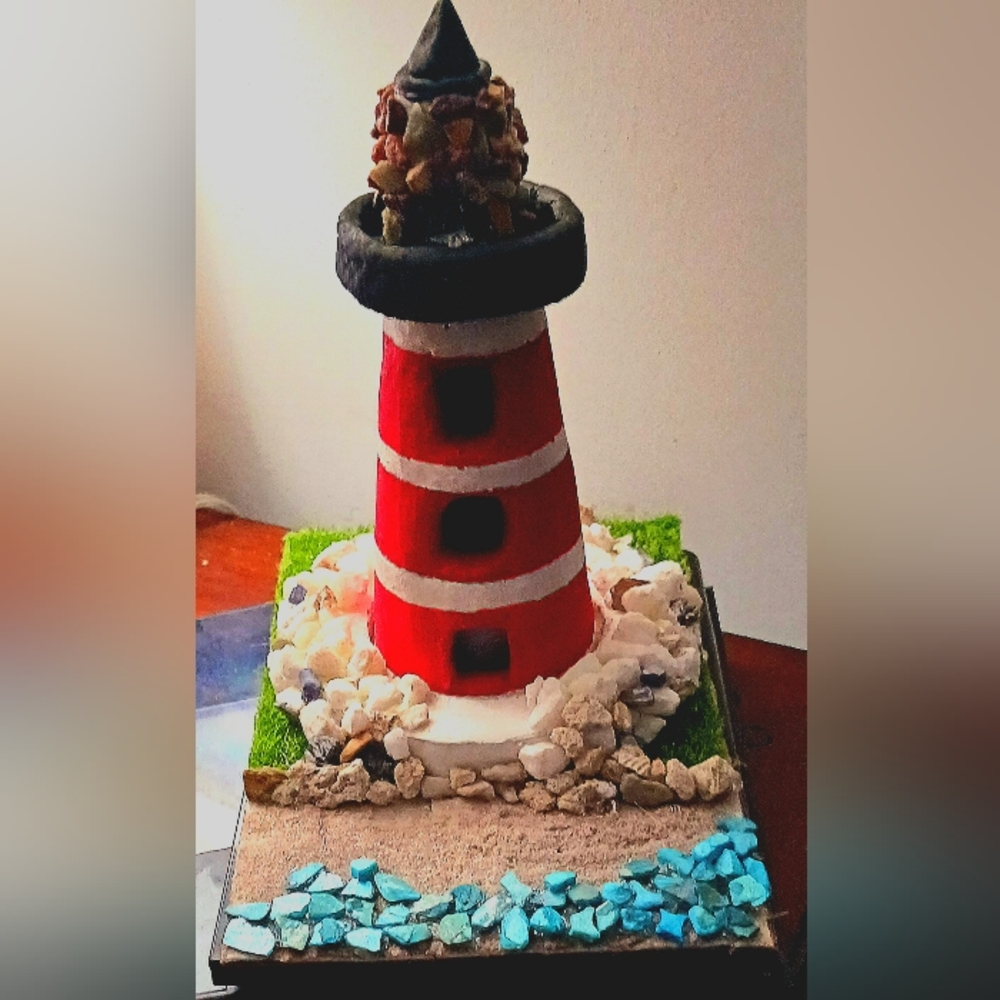Handmade clay lighthouse candle holder/nightlight.